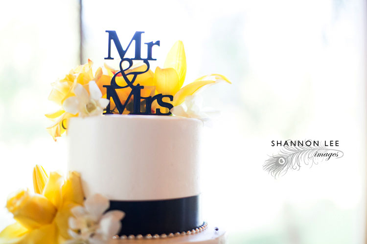 yellow and black wedding cake