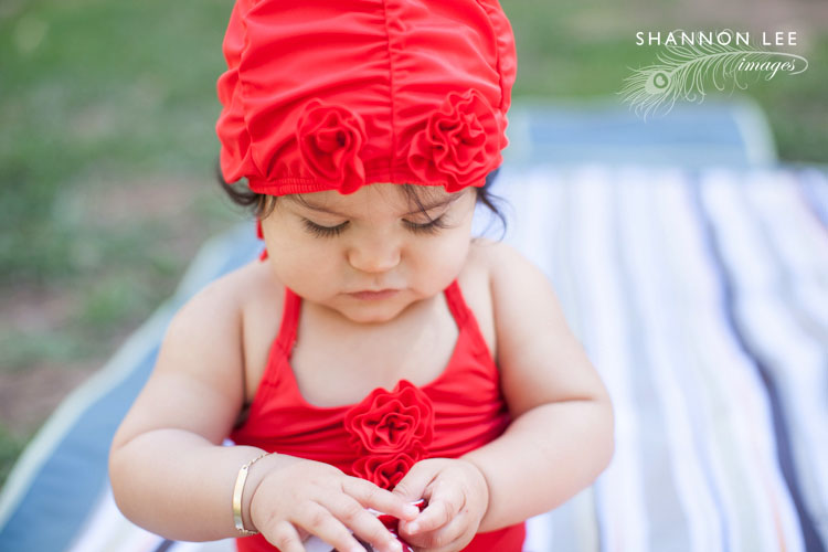 red baby swimsuit and cap