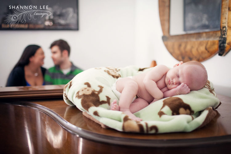 newborn sleeping on piano